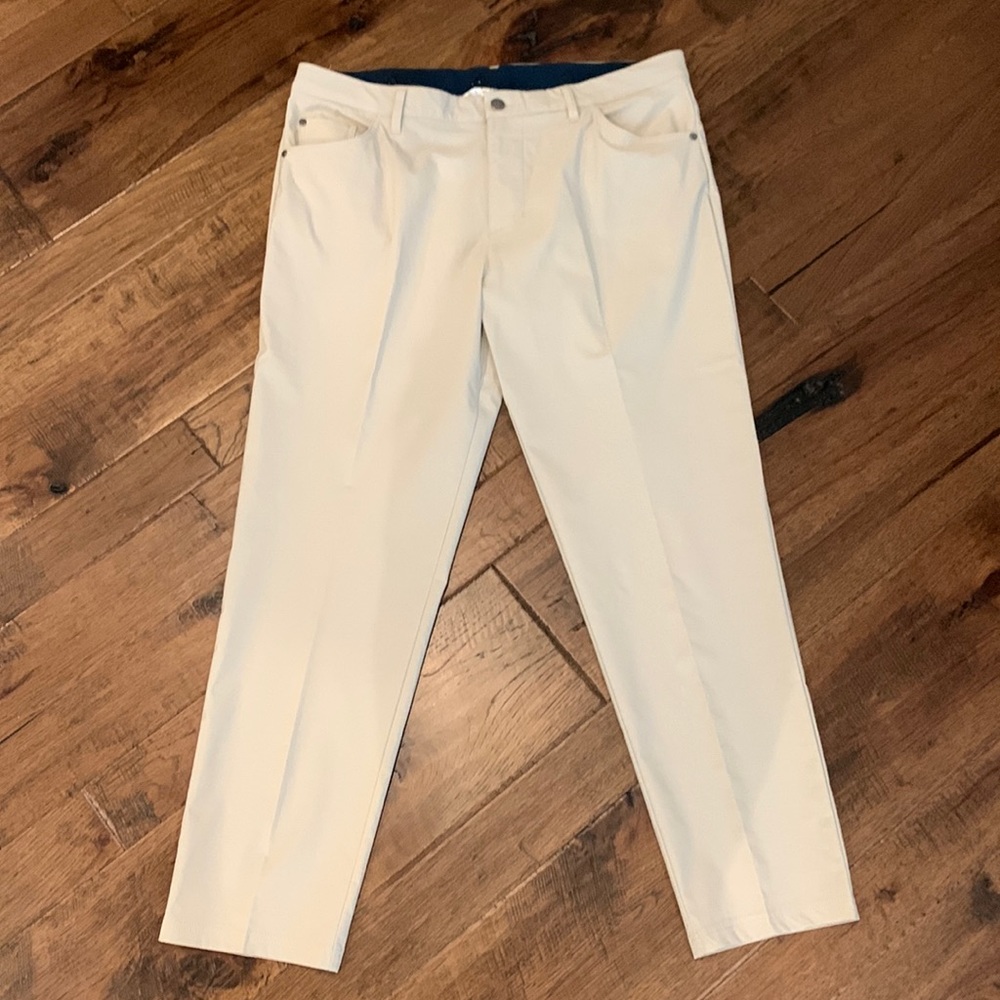 NWOT Adidas golf pants, 5 pocket pant, khaki in perfect condition. Tapered fit